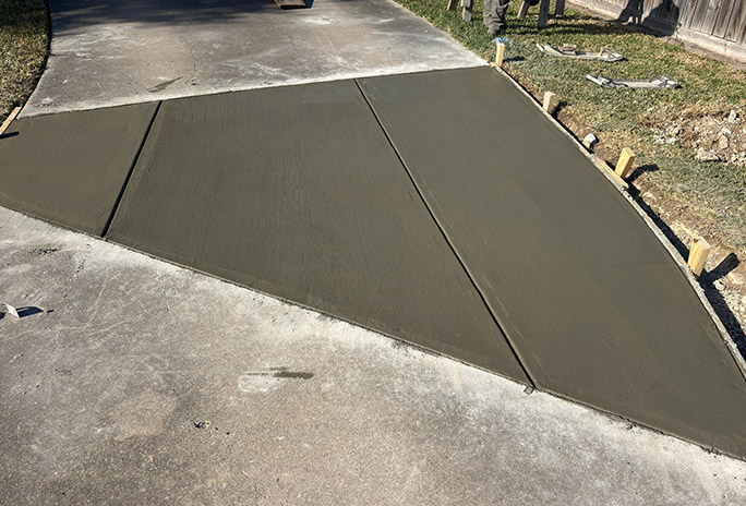 Completed commercial concrete sidewalk repair with clean smooth finish by S&V Concrete And More